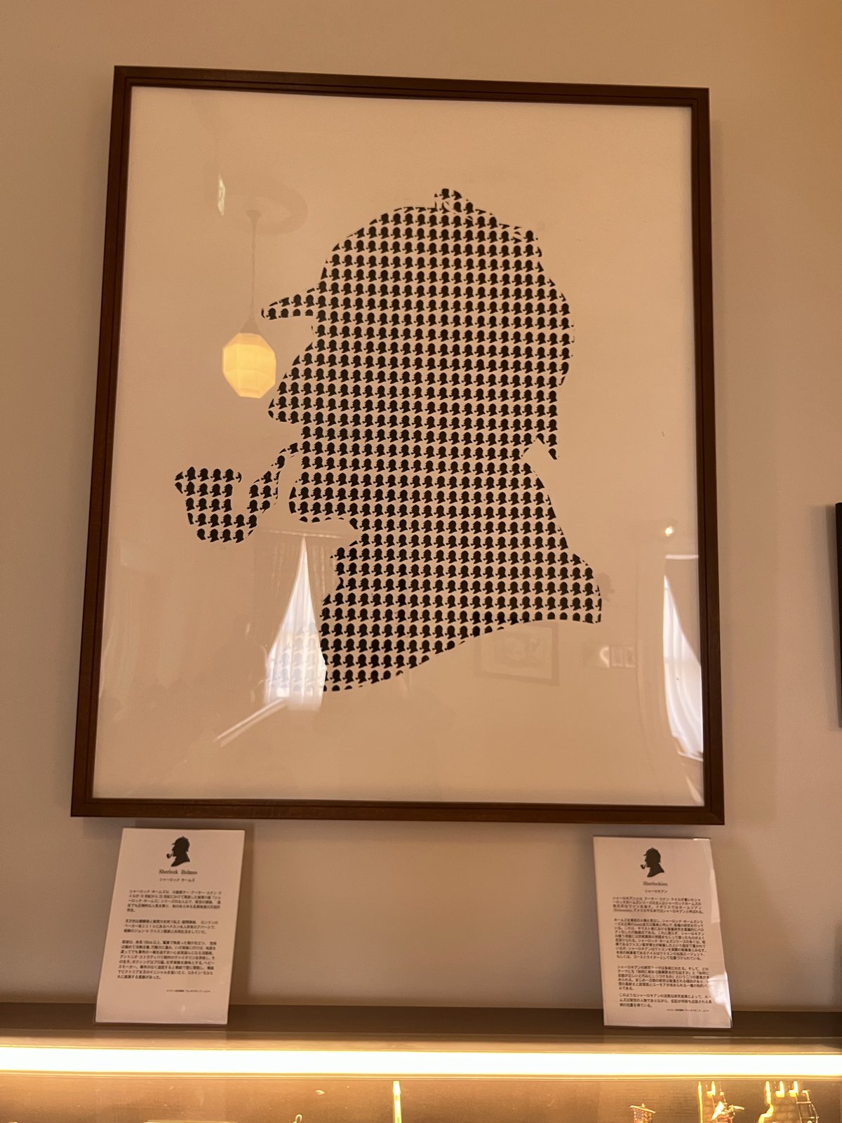 A framed tribute with his distinctive pipe and deerstalker hat.
