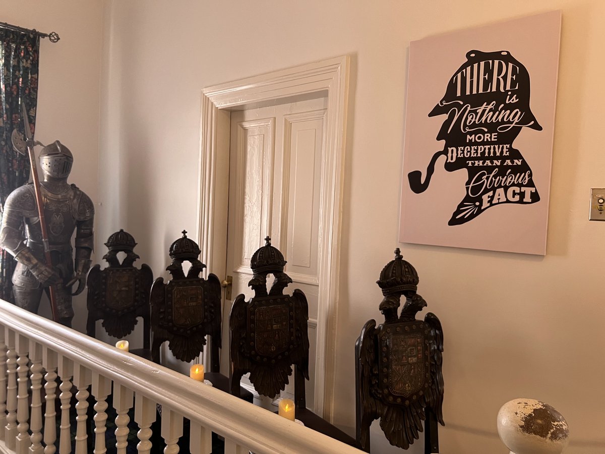 A knight in armor guards the hallway.