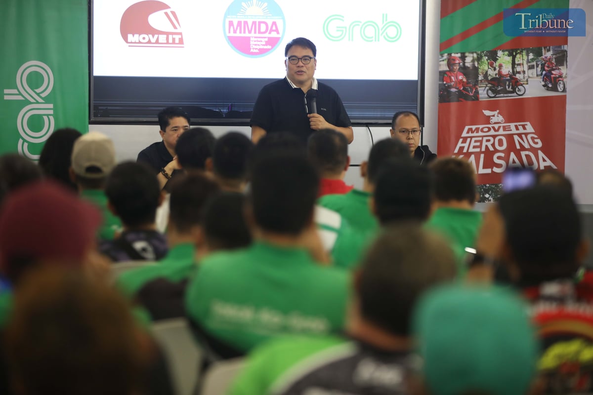 Metropolitan Manila Development Authority Chairman Don Artes, along with Traffic Discipline Office head Victor Nuñez and Special Operations Group Strike Force head Gabriel Go, speaks with MOVE IT and Grab drivers about the NCAP rules during a forum at the Asenso Center on A. Bonifacio Avenue, Barangka, Marikina City, on Saturday.