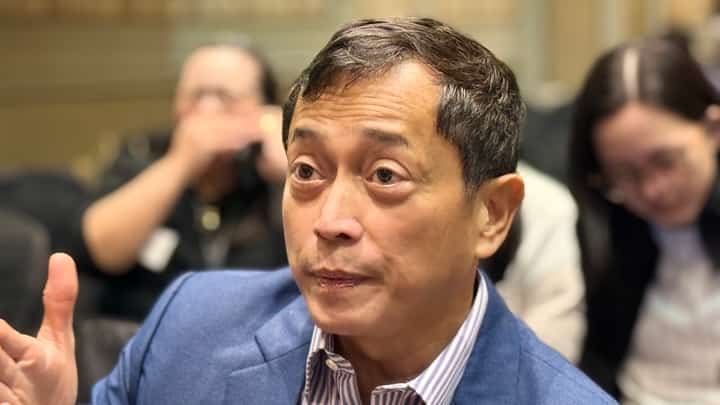 EDC President and Chief Operating Officer Jerome H. Cainglet speaks to reporters before parent firm’s annual stockholders meeting.