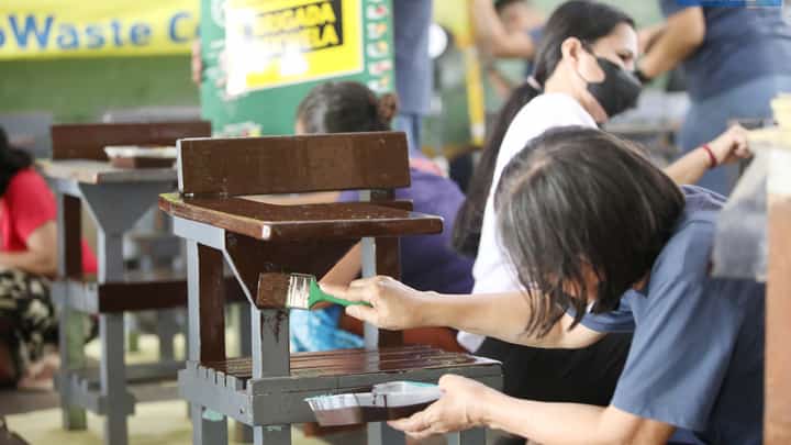 EcoWaste Coalition joins teachers, parents, and students in repainting chairs during Brigada Eskwela at Pinyahan Elementary School in Quezon City on Monday, 9 June, in preparation for the school opening on 16 June.