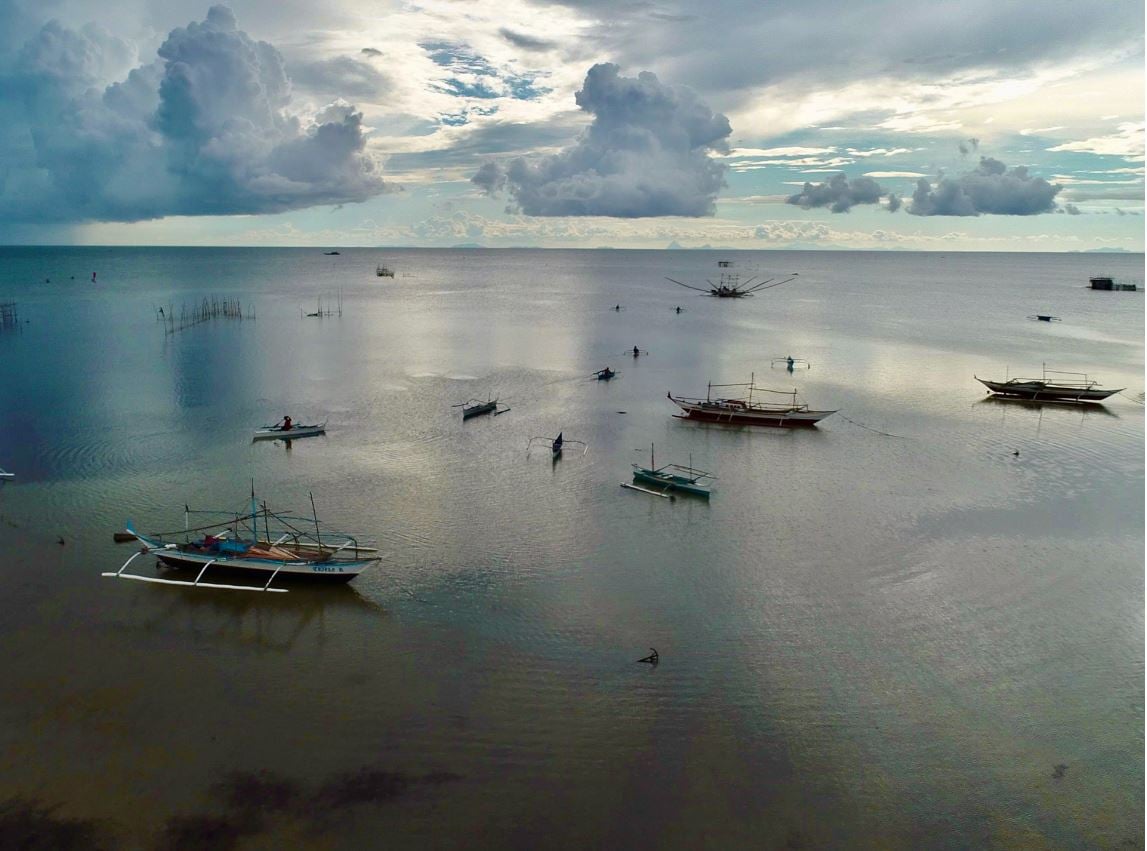 Fisherfolks, wives receive boats, livelihood 