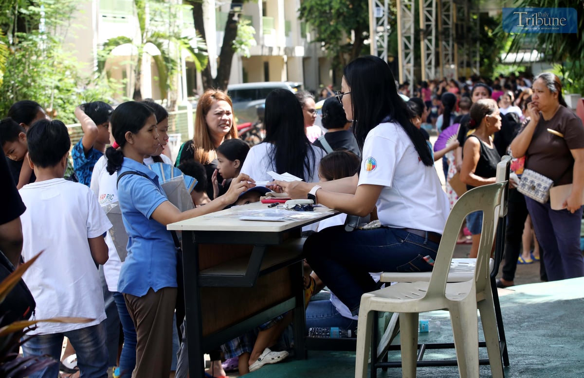 Parents line up to enroll their children at Pinyahan Elementary School in Quezon City on Monday, 9 June 2025, just a week ahead of the official school opening on 16 June.