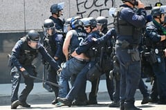 Los Angeles scuffles seen as soldiers sent by Trump fan out