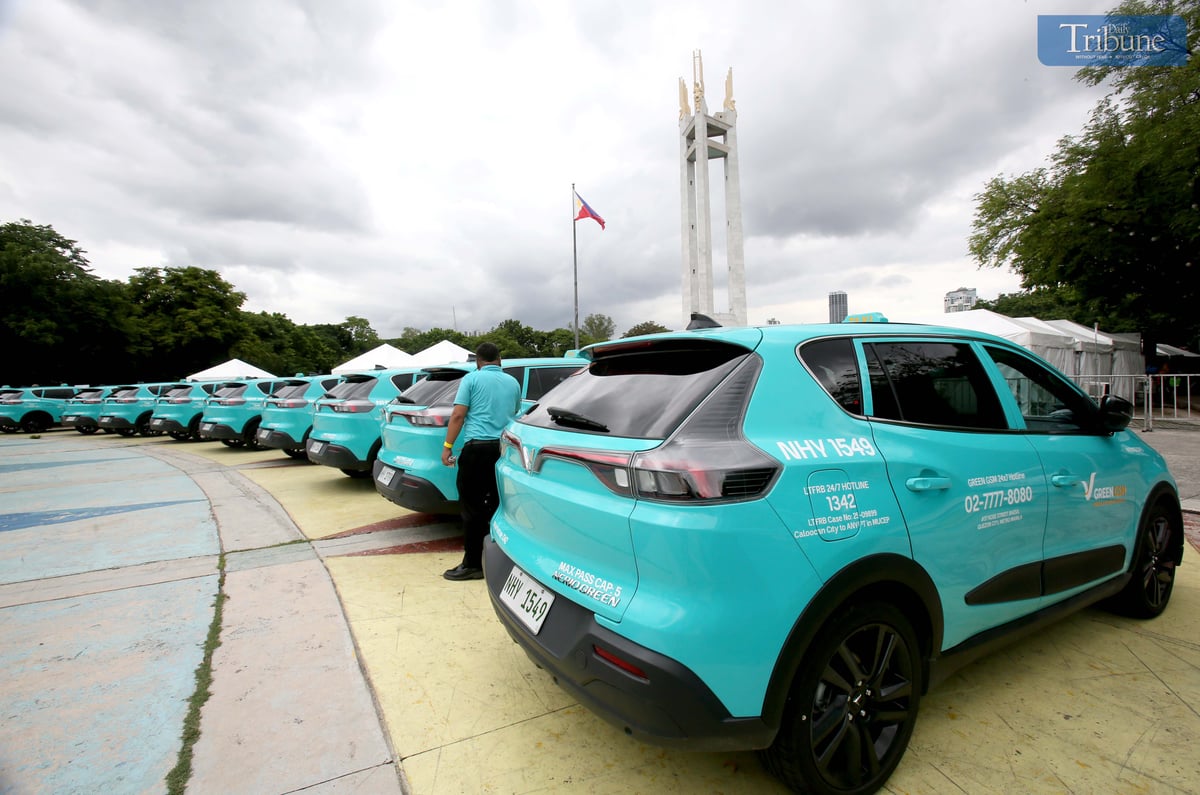 A Green GSM Philippines electric taxi is seen parked at Quezon City Memorial Circle on Tuesday, 10 June 2025, during the launch of the “Green and Smart Mobility” initiative. The event showcased sustainable transport solutions, electric vehicles, and smart mobility technologies aimed at promoting eco-friendly urban transport nationwide.