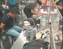 OFFICE for Transportation Security personnel at NAIA Terminal 3 conduct manual inspection of a passenger’s backpack