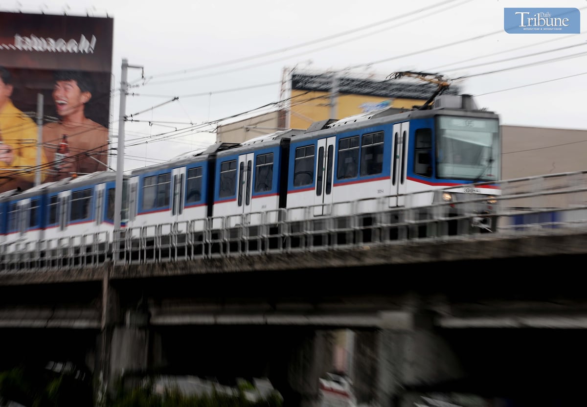 A Metro Rail Transit Line 3 (MRT-3) train travels along EDSA in Quezon City on Tuesday, 10 June 2025. The Department of Transportation (DOTr) announced that the MRT-3 will offer free rides on 12 June, in celebration of the 127th Philippine Independence Day. Free rides will be available from 7 AM to 9 AM and 5 PM to 7 PM