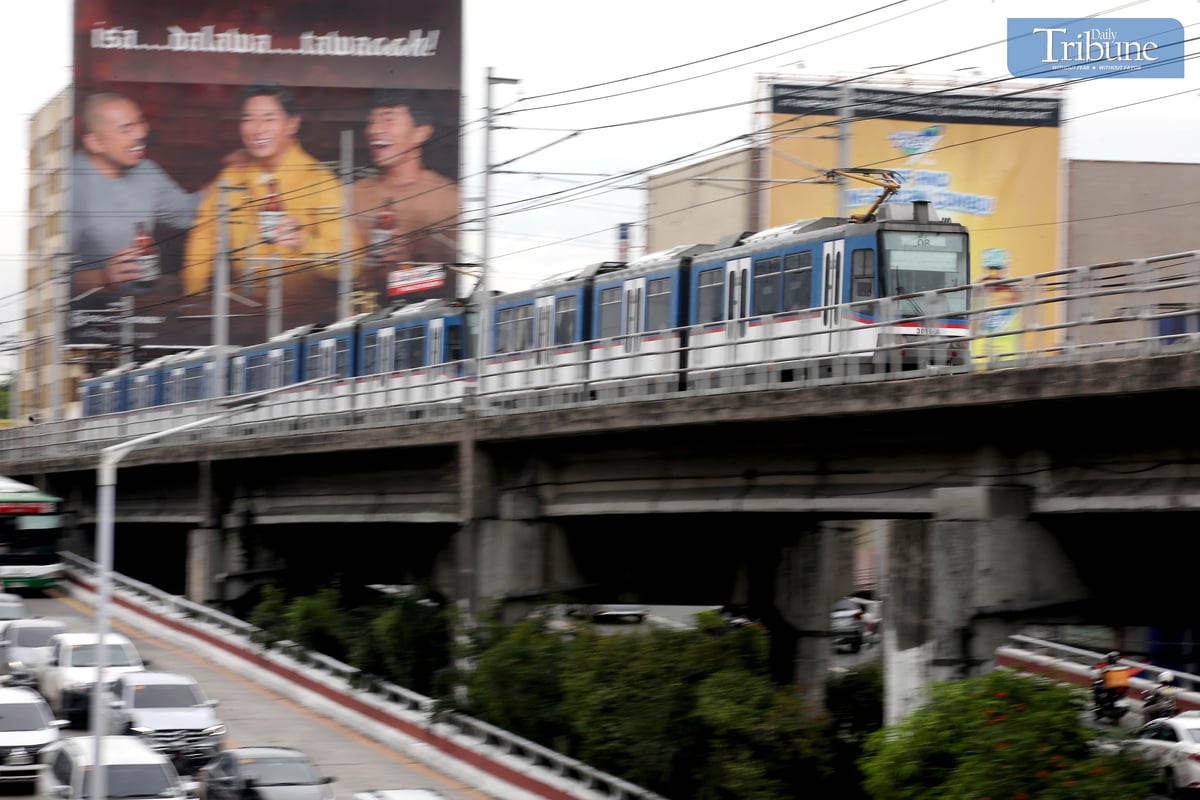 A Metro Rail Transit Line 3 (MRT-3) train travels along EDSA in Quezon City on Tuesday, 10 June 2025. The Department of Transportation (DOTr) announced that the MRT-3 will offer free rides on 12 June, in celebration of the 127th Philippine Independence Day. Free rides will be available from 7 AM to 9 AM and 5 PM to 7 PM