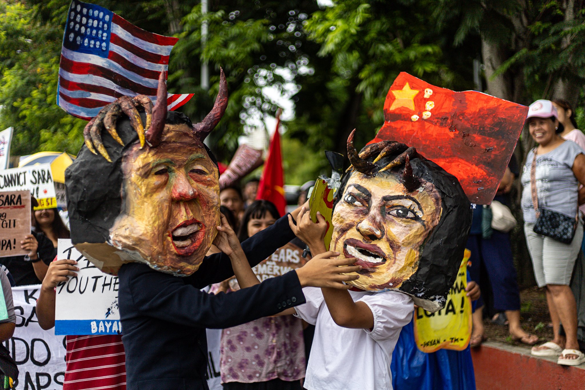 Masked protesters denounce Senate’s move on Duterte impeachment