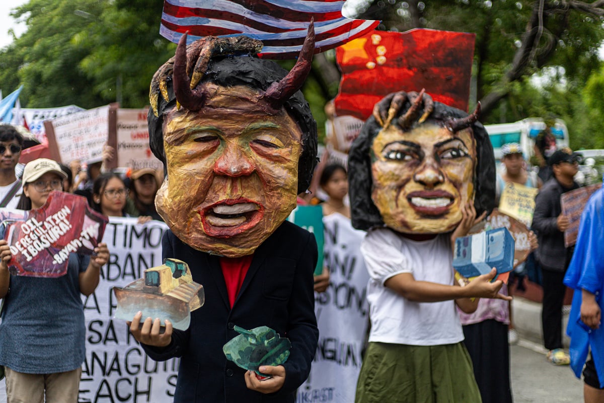 Protesters wearing masks resembling President Ferdinand Marcos Jr. and Vice President Sara Duterte stage a rally outside the Senate building in Pasay City on Wednesday, 11 June 2025, to denounce the Senate’s decision to return Vice President Duterte’s impeachment case to the House of Representatives.