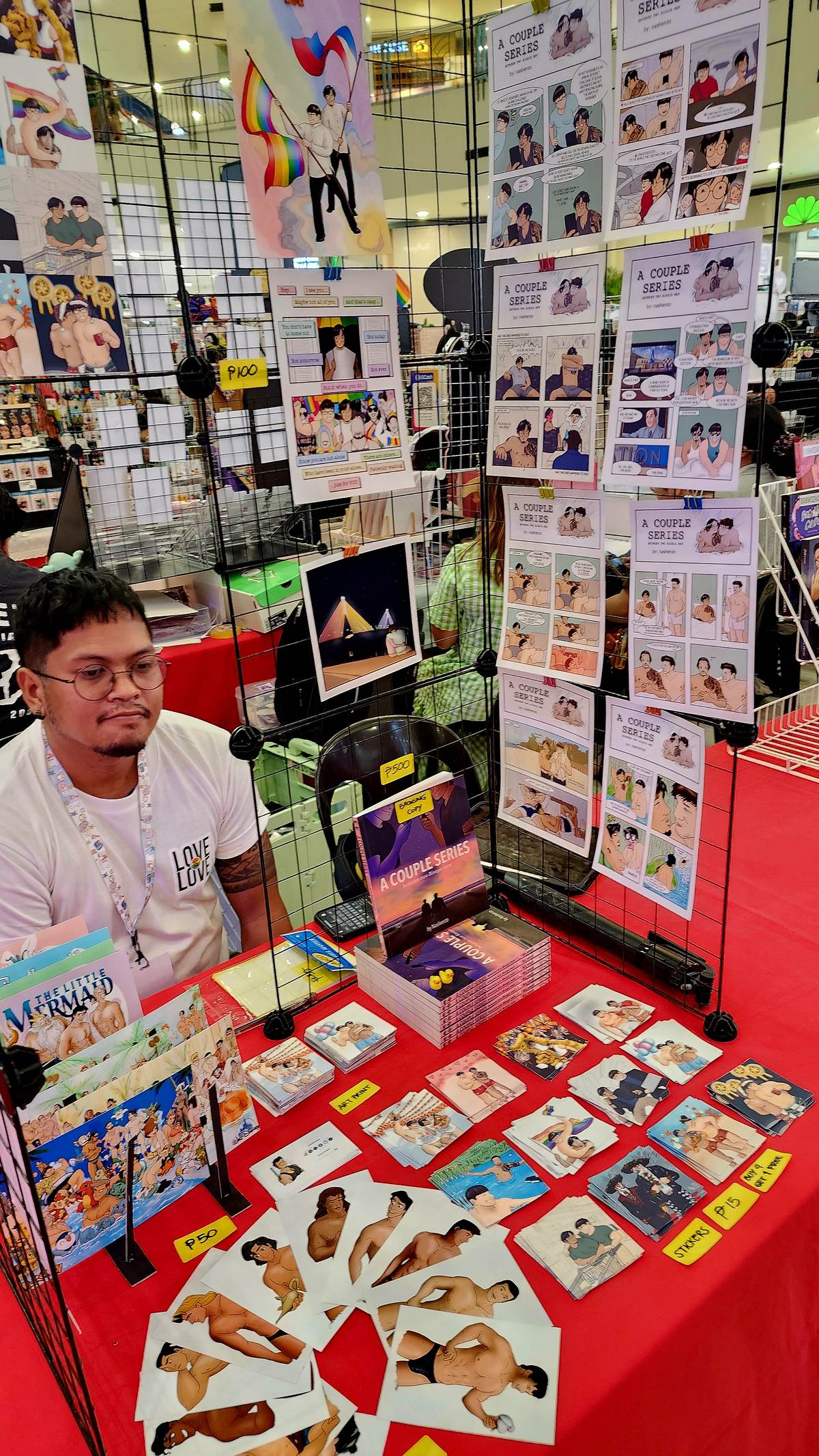 Cebuano komiks creator Nashenzo with his works including the Boys’ Love comic book, ‘A Couple Series.’