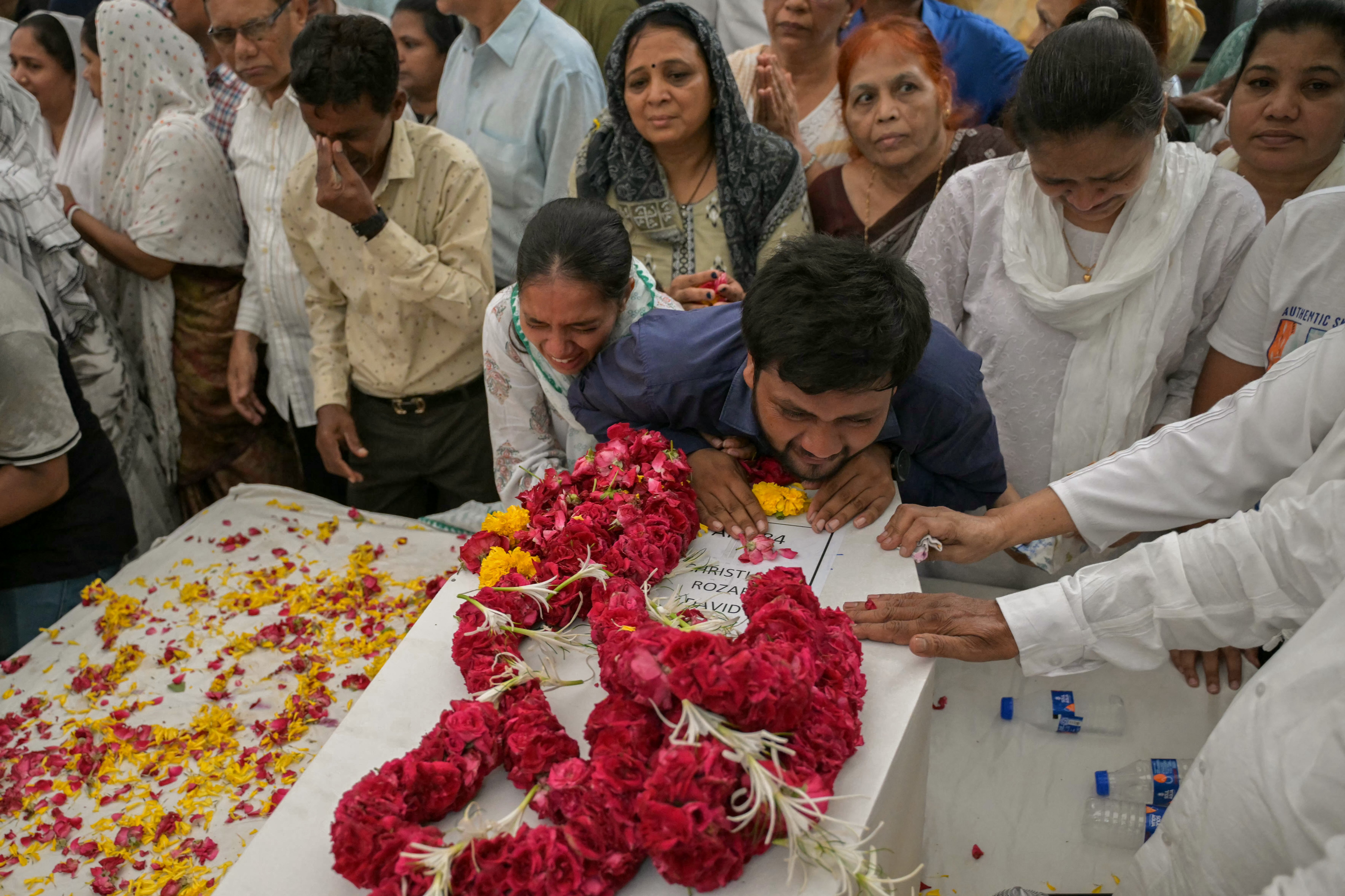 Relatives await family remains after Air India crash