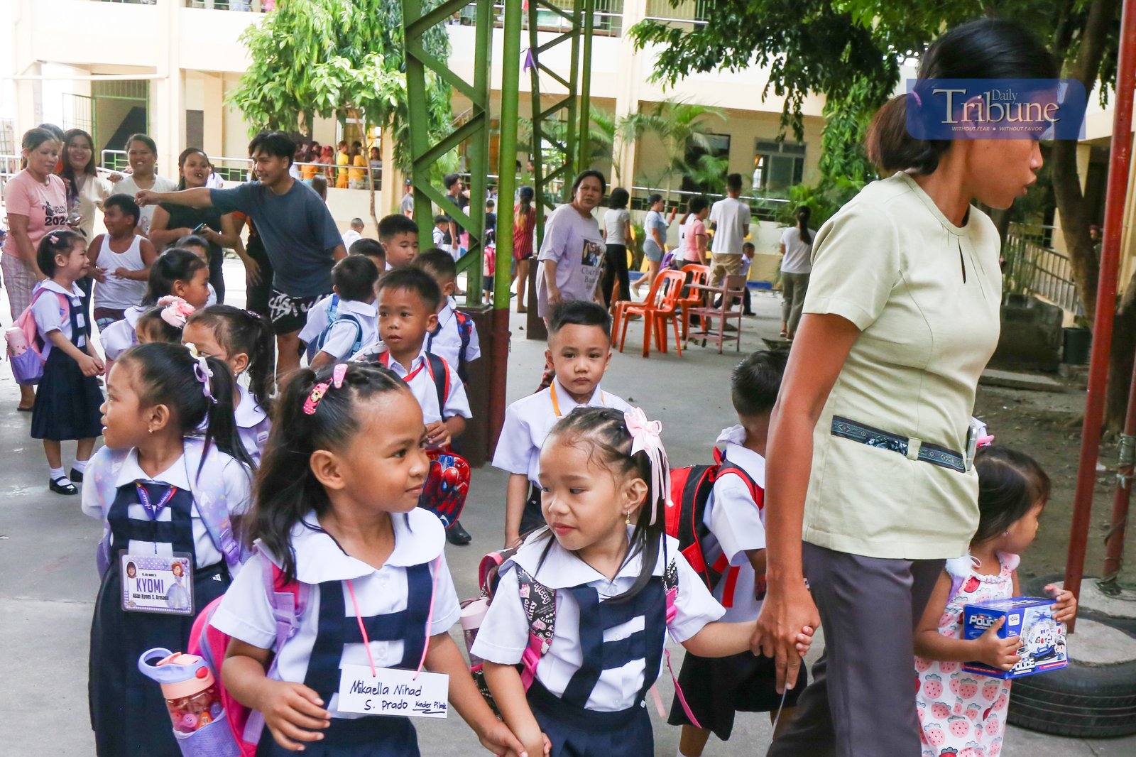 Parents accompany their children to a kindergarten school in Manila on Monday, 16 June 2025, marking the official start of the June-to-March academic year.