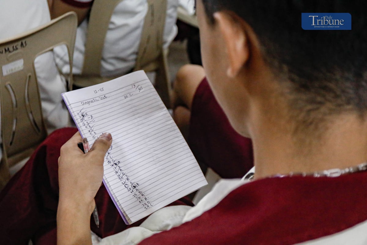 STUDENTS listen to their teacher at Nick M. Joaquin Senior High School in Quezon City during the first day of classes, Monday, 16 June 2025.