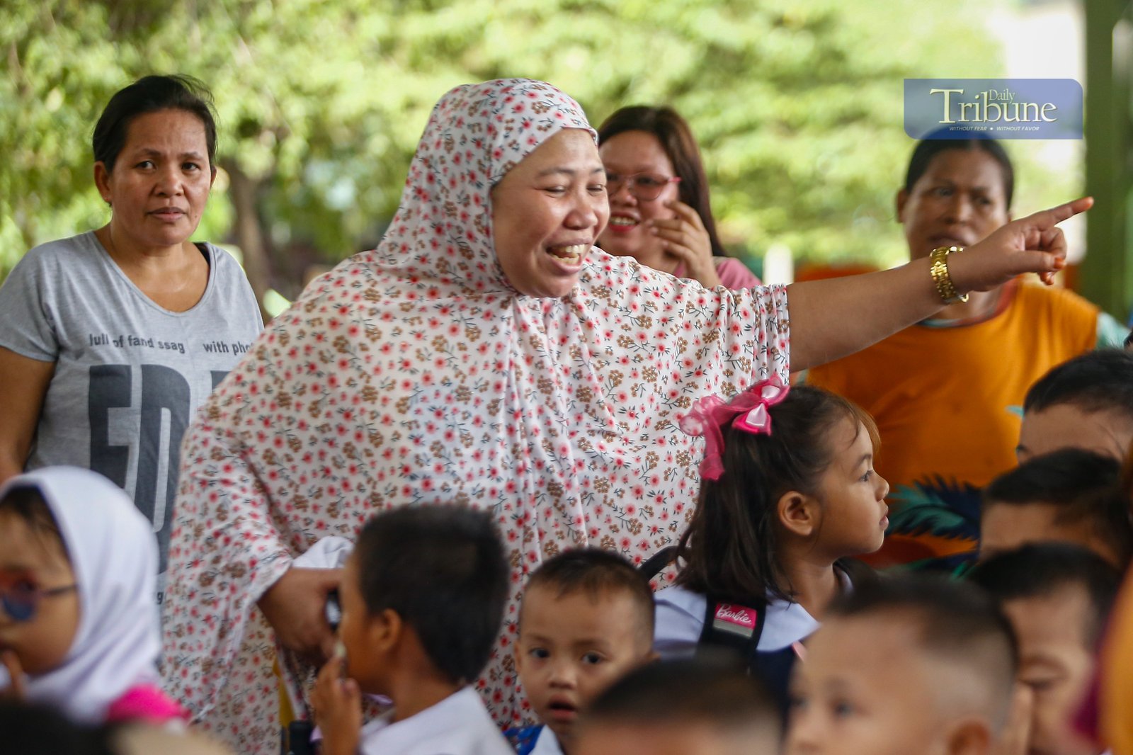 Parents accompany their children to a kindergarten school in Manila on Monday, 16 June 2025, marking the official start of the June-to-March academic year.