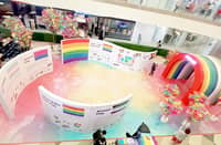 Informative panels on LGBTIQ+ flags at the mall’s activity area.