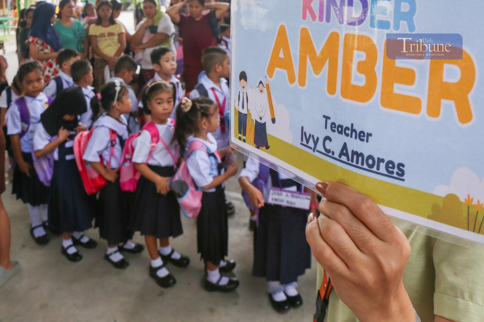Parents accompany their children to a kindergarten school in Manila on Monday, 16 June 2025, marking the official start of the June-to-March academic year.