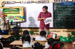 ‘Teacher Marcos’ checks students’ reading skills