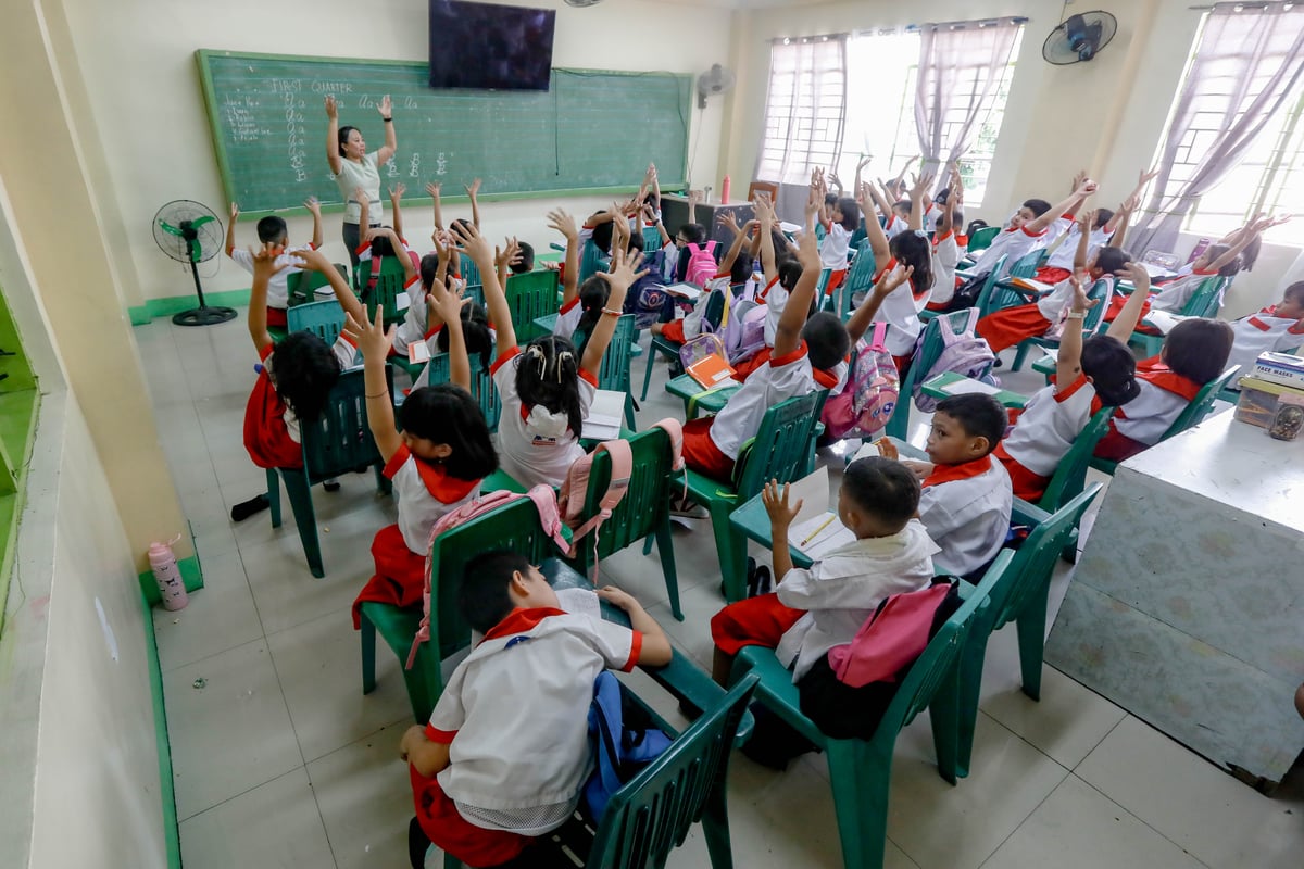 Kinder and elementary pupils of Pedro Cruz Elementary School join warm-up activities led by their teachers on the first day of classes, Monday, 16 June 2025.