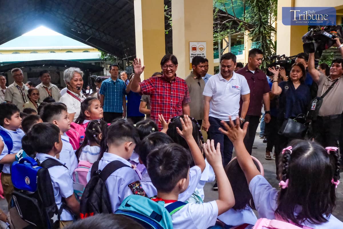 President Ferdinand R. Marcos Jr. waves at students during his at Epifanio Delos Santos Elementary School in Malate, Manila, on Monday, June 16, 2025, PHOTOS BY YUMMIE DINGDING