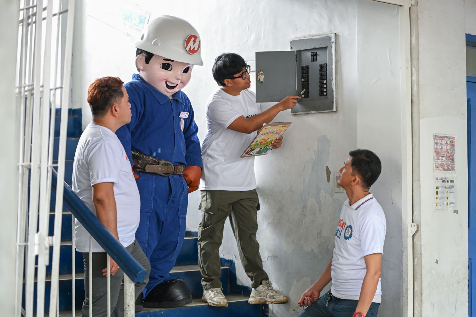INSPECTING the school’s electrical facilities by Meralco engineers is part of OMF’s ‘Safe ang School Ko’ initiative implemented during Brigada Eskwela.