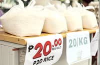 A VENDOR scoops up P20 per kilo of rice outside the Manila Central Post Office in Liwasang Bonifacio, Manila.