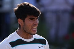 Drained Alcaraz survives big scare