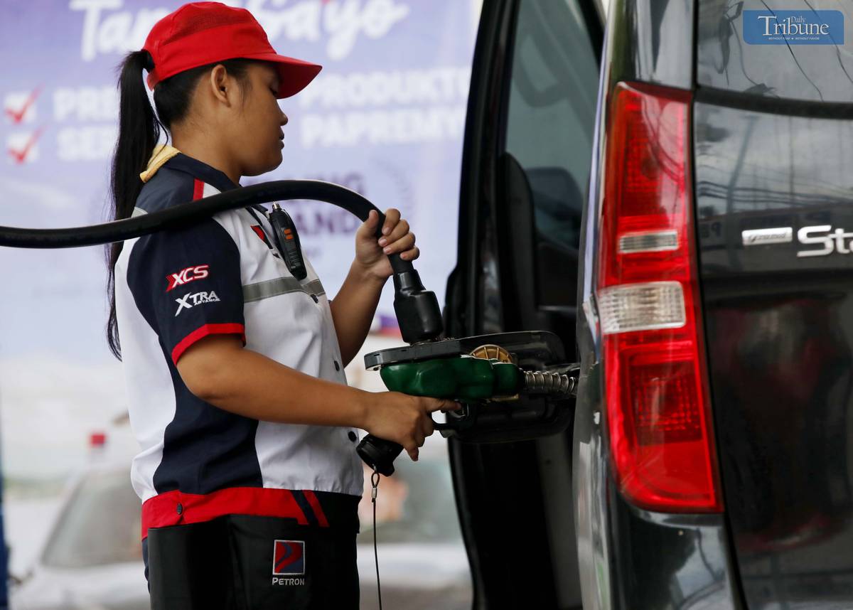 GAS station personnel assist motorists refueling at a station along East Avenue in Quezon City on Friday, 20 June. The Department of Energy warned that diesel prices may increase by up to P5 per liter next week due to rising global oil prices. President Ferdinand Marcos Jr. earlier said the government is prepared to provide fuel subsidies to sectors most affected by potential oil supply disruptions stemming from tensions between Israel and Iran.