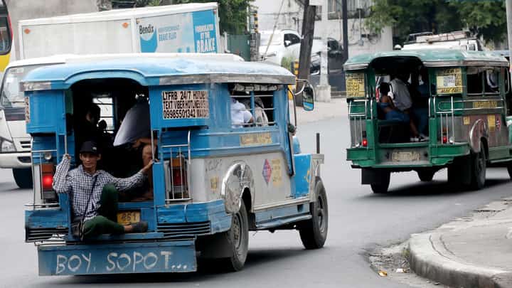 A public utility jeepney unloads passengers along Kamias Road in Quezon City on Friday, 20 June 2025. The Land Transportation Franchising and Regulatory Board (LTFRB) said a P1 flat rate increase in jeepney fares could take effect by the first week of July, following the continued rise in fuel prices.