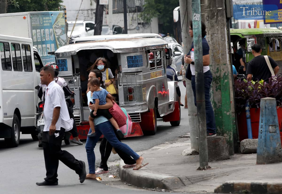 A public utility jeepney unloads passengers along Kamias Road in Quezon City on Friday, 20 June 2025. The Land Transportation Franchising and Regulatory Board (LTFRB) said a P1 flat rate increase in jeepney fares could take effect by the first week of July, following the continued rise in fuel prices.