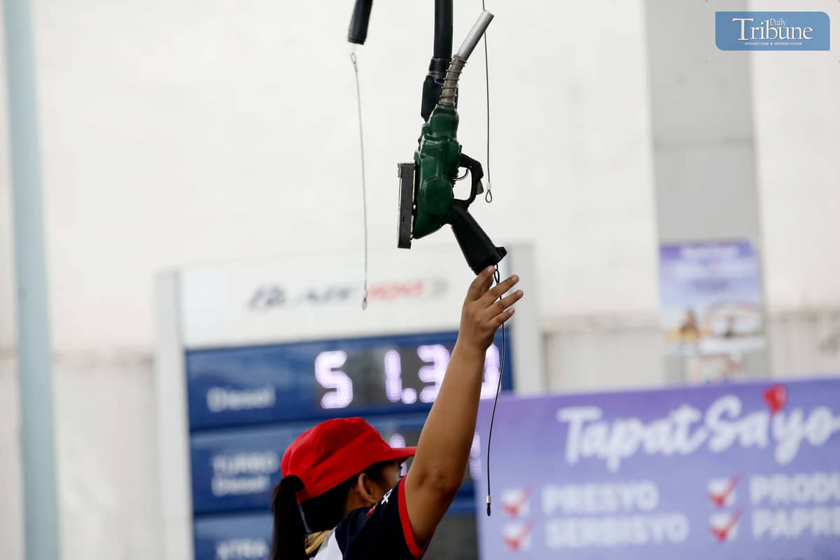 GAS station personnel assist motorists refueling at a station along East Avenue in Quezon City on Friday, 20 June. The Department of Energy warned that diesel prices may increase by up to P5 per liter next week due to rising global oil prices. President Ferdinand Marcos Jr. earlier said the government is prepared to provide fuel subsidies to sectors most affected by potential oil supply disruptions stemming from tensions between Israel and Iran.
