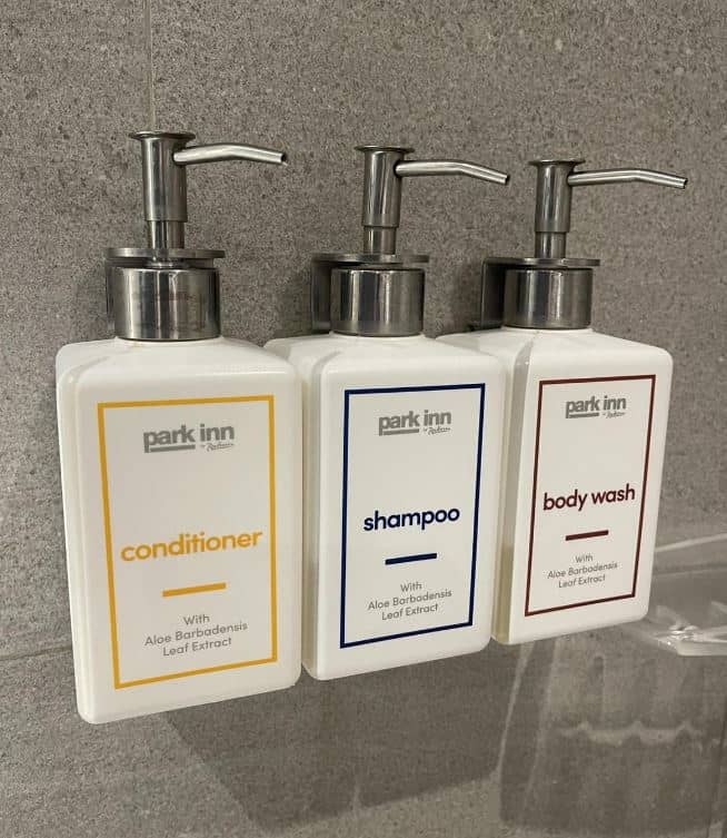Amenity dispensers Single-use plastic tubes for amenities were converted to dispensers to reduce plastic waste.