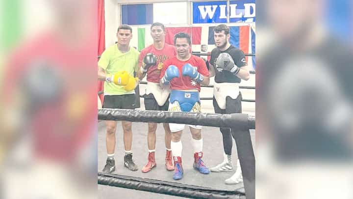 Manny Pacquiao gets quality work with his sparring partners, including Saul Bustos (second from left) at the Wild Card Boxing Club in Hollywood.