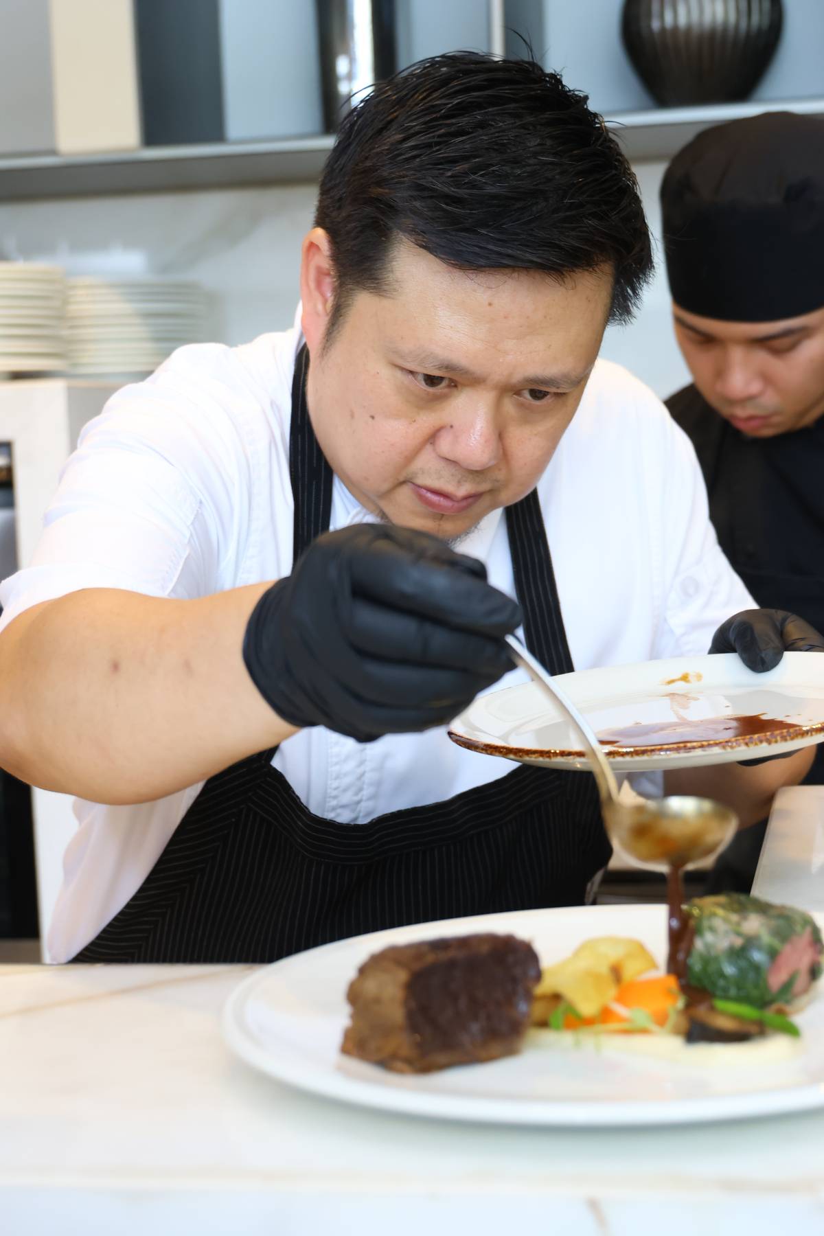 Executive chef Luis Chikiamko plating the specially curated menu.