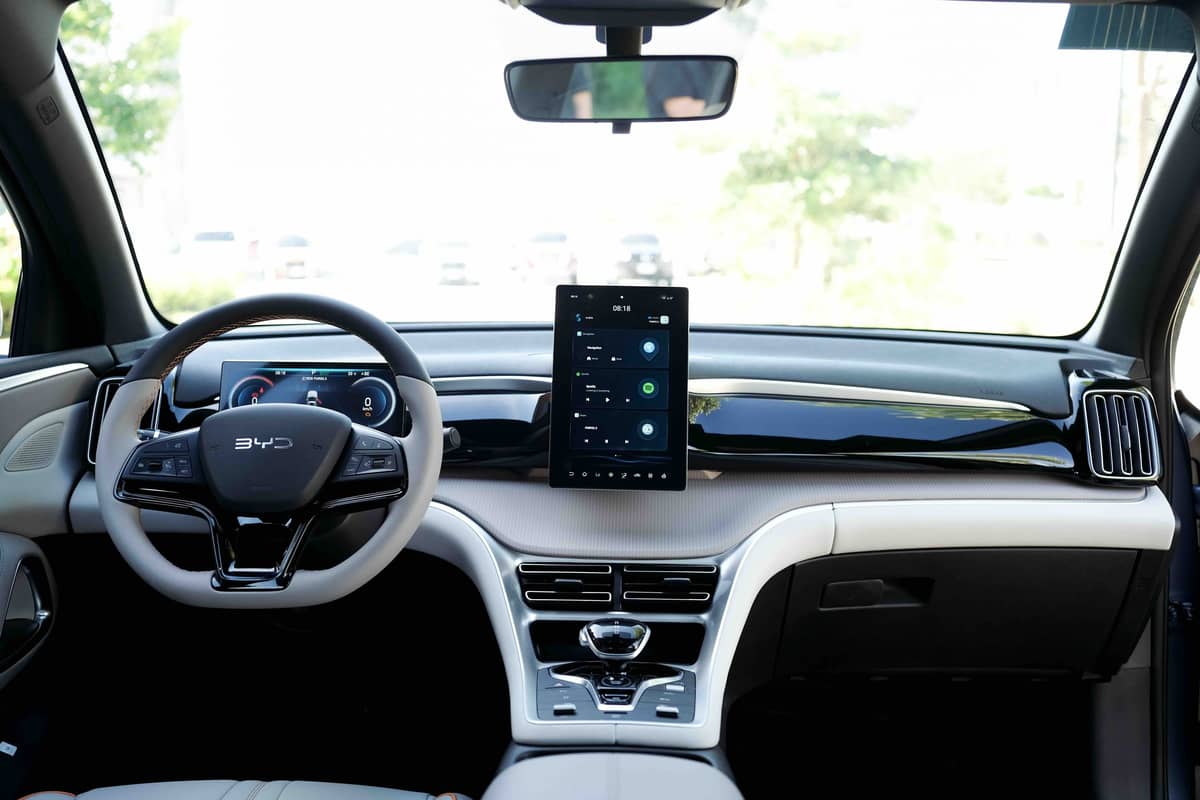 INSIDE the Sealion 5 DM-i is a driver-focused cabin with a rotating touchscreen, smooth materials, and tech that feels intuitive from the start.