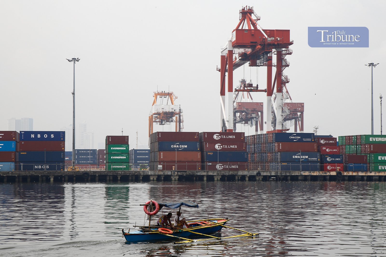 Heavy lifters load container vans onto a waiting trailer truck at a port terminal in Manila. The ongoing Iran-Israel conflict has notably affected Philippine imports and exports, mainly through disruptions in global oil prices, fertilizer supplies, and shipping routes.