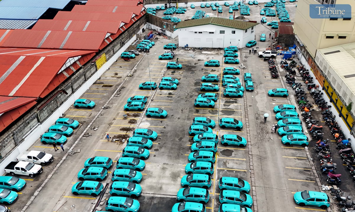 Electric vehicle (EV) taxi units are seen charging at a garage in Caloocan City on Monday, 23 June 2025. Unlike traditional gasoline-powered taxis, these eco-friendly units run on electric motors and can travel up to 290 kilometers on a full charge—which takes about an hour and 30 minutes.