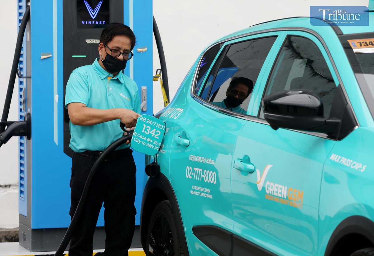 Electric vehicle (EV) taxi units are seen charging at a garage in Caloocan City on Monday, 23 June 2025. Unlike traditional gasoline-powered taxis, these eco-friendly units run on electric motors and can travel up to 290 kilometers on a full charge—which takes about an hour and 30 minutes.