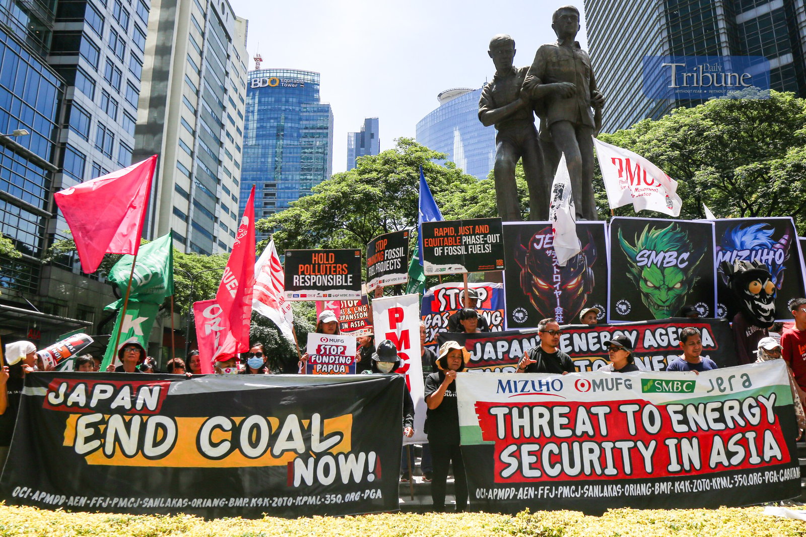 Climate advocates rally at the Ninoy Aquino Monument in Makati City on 24 June 2025, urging the Japanese government and its financiers to end support for coal and other fossil fuel projects in the Philippines and across Asia. They call instead for stronger investments in renewable energy like solar and wind.