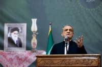 This handout picture provided by the Iranian presidency shows Iran's President Masoud Pezeshkian giving an address on the anniversary of the death of the country's former supreme leader Ayatollah Ruhollah Khomeini at the latter's mausoleum in Tehran on June 3, 2025.