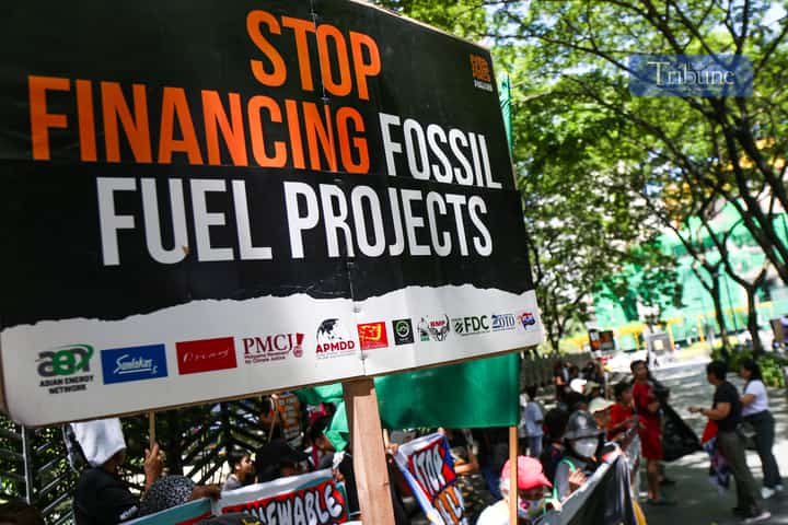 Climate advocates rally at the Ninoy Aquino Monument in Makati City on 24 June 2025, urging the Japanese government and its financiers to end support for coal and other fossil fuel projects in the Philippines and across Asia. They call instead for stronger investments in renewable energy like solar and wind.