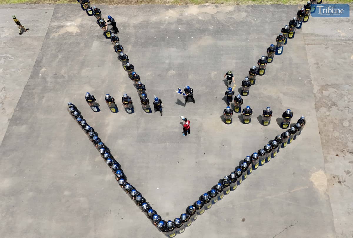 READY FOR ACTION. Members of the Quezon City Police District’s Civil Disturbance Management (CDM) unit rehearse their formation at Camp Karingal Grandstand on Wednesday, June 25, 2025. The team is gearing up for the CDM competition against other Metro Manila police districts, to be held at the NCRPO headquarters in Taguig City on July 3.
