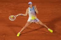 Poland's Iga Swiatek plays a forehand return to Belarus' Aryna Sabalenka during their women's singles semi-final match on day 12 of the French Open tennis tournament on Court Philippe-Chatrier at the Roland-Garros Complex in Paris on June 5, 2025.
