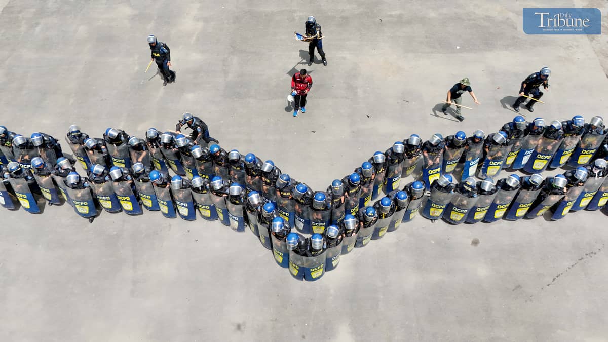 READY FOR ACTION. Members of the Quezon City Police District’s Civil Disturbance Management (CDM) unit rehearse their formation at Camp Karingal Grandstand on Wednesday, June 25, 2025. The team is gearing up for the CDM competition against other Metro Manila police districts, to be held at the NCRPO headquarters in Taguig City on July 3.