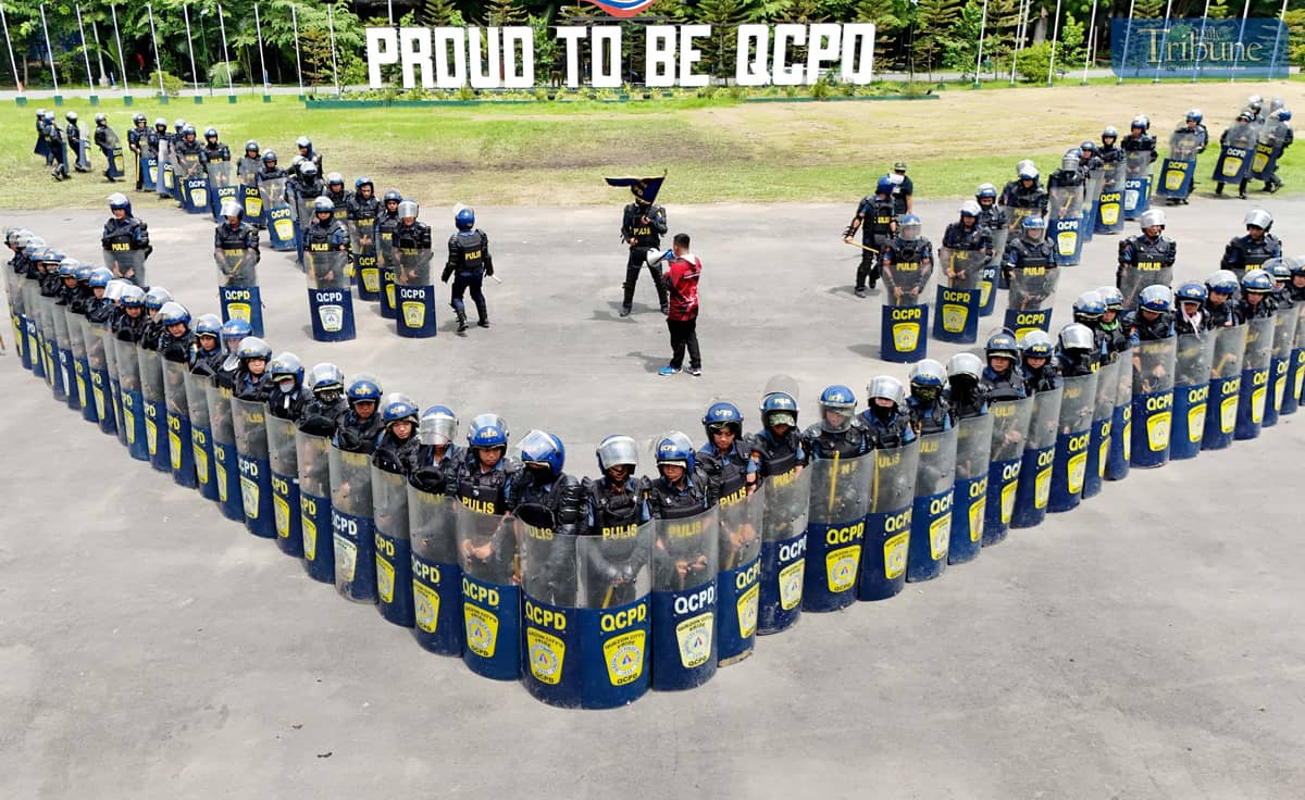 READY FOR ACTION. Members of the Quezon City Police District’s Civil Disturbance Management (CDM) unit rehearse their formation at Camp Karingal Grandstand on Wednesday, June 25, 2025. The team is gearing up for the CDM competition against other Metro Manila police districts, to be held at the NCRPO headquarters in Taguig City on July 3.