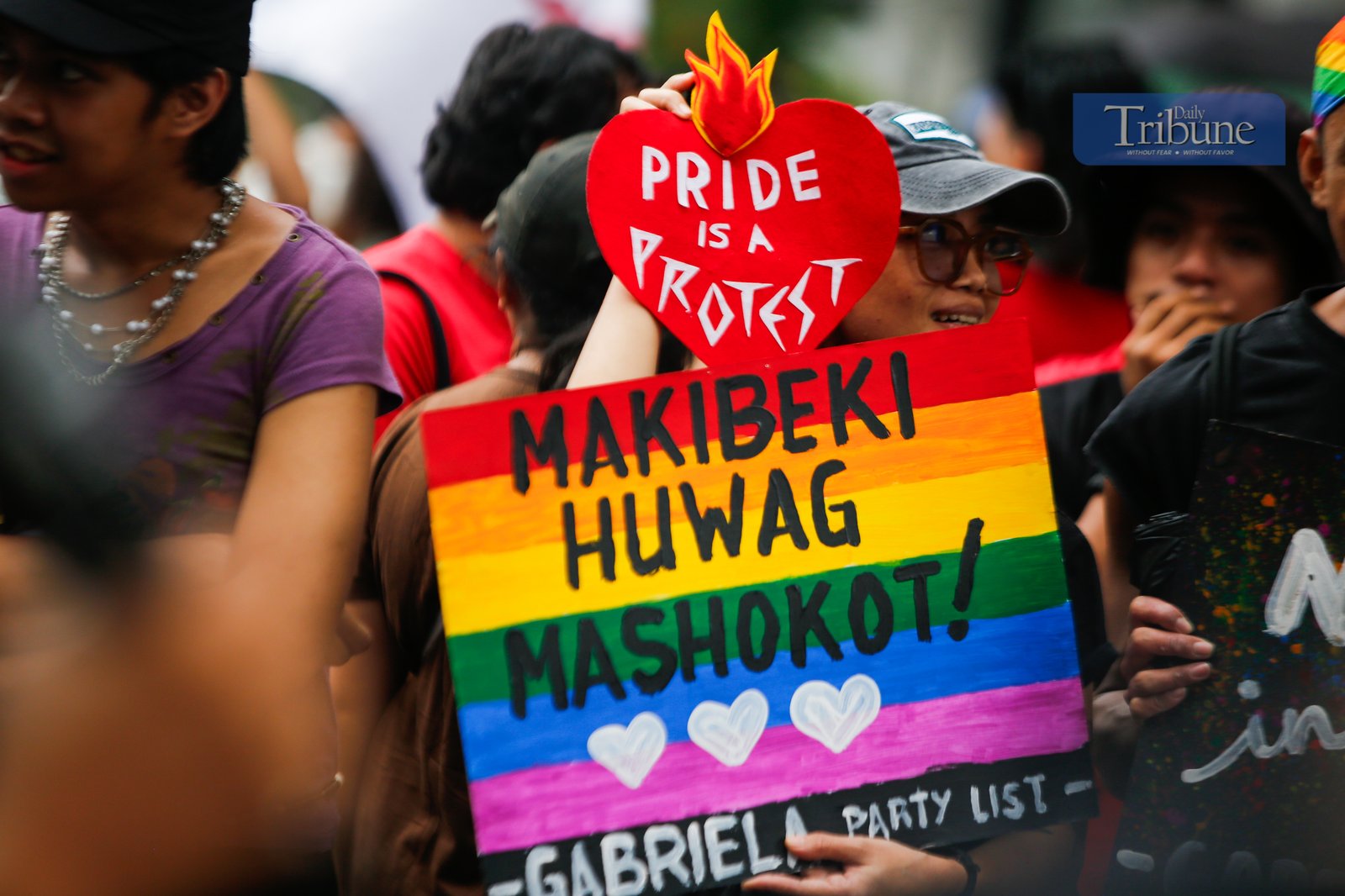 ISN'T BLUE PART OF THE RAINBOW? Policemen clash with activists along Recto Avenue in Manila on the morning of 26 June 2025. Activists commemorate "Stonewall Manila," the first LGBT Pride March in the Philippines, 31 years ago. Human rights activists call for an end to hate crimes and assault against members of the LGBTQIA+ community.