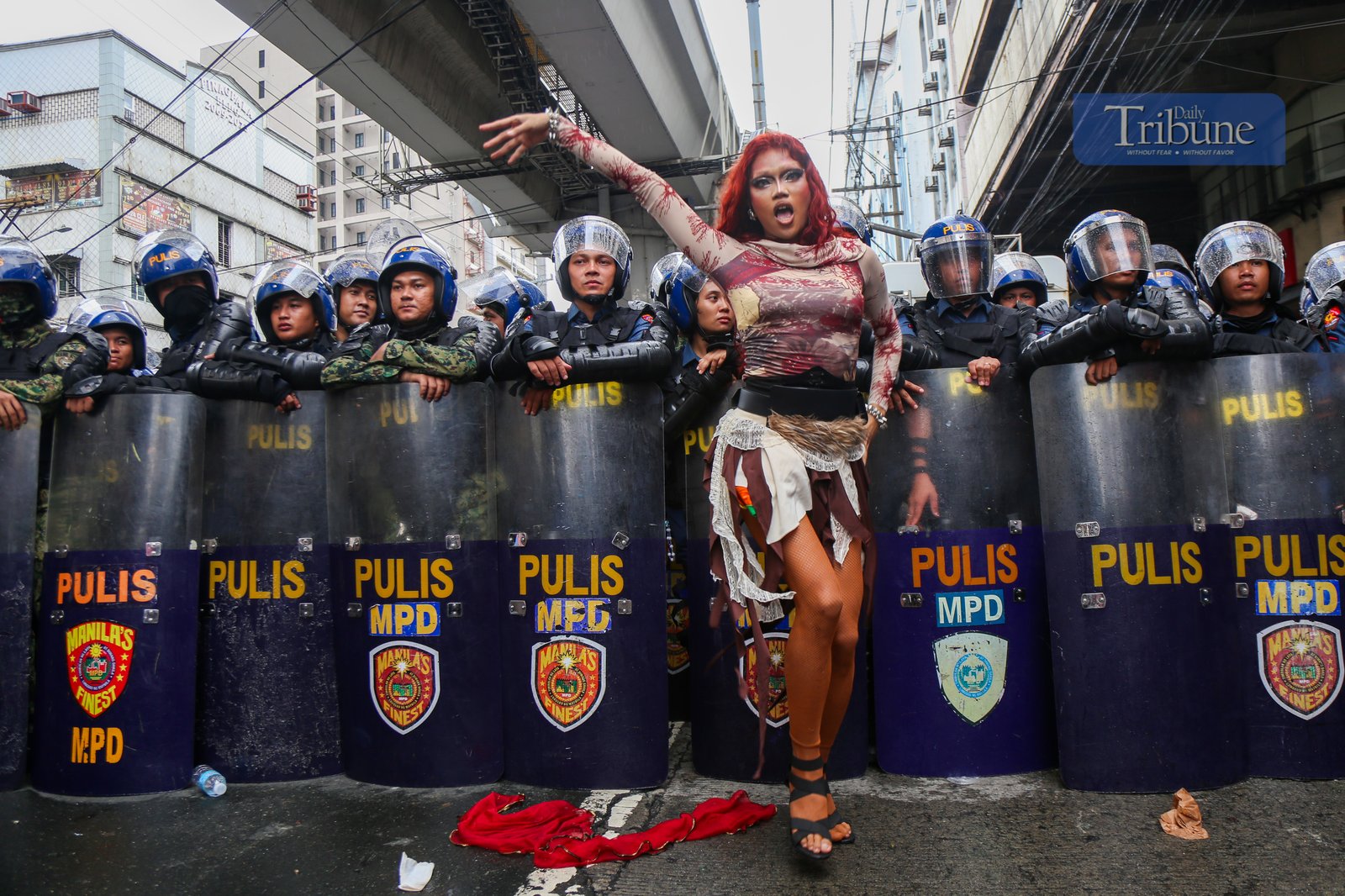 ISN'T BLUE PART OF THE RAINBOW? Policemen clash with activists along Recto Avenue in Manila on the morning of 26 June 2025. Activists commemorate "Stonewall Manila," the first LGBT Pride March in the Philippines, 31 years ago. Human rights activists call for an end to hate crimes and assault against members of the LGBTQIA+ community.