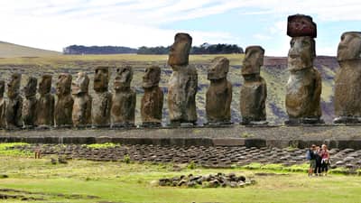 The 15 Tongariki moai, standing erect in rigid military attention, are the largest statues on the island.