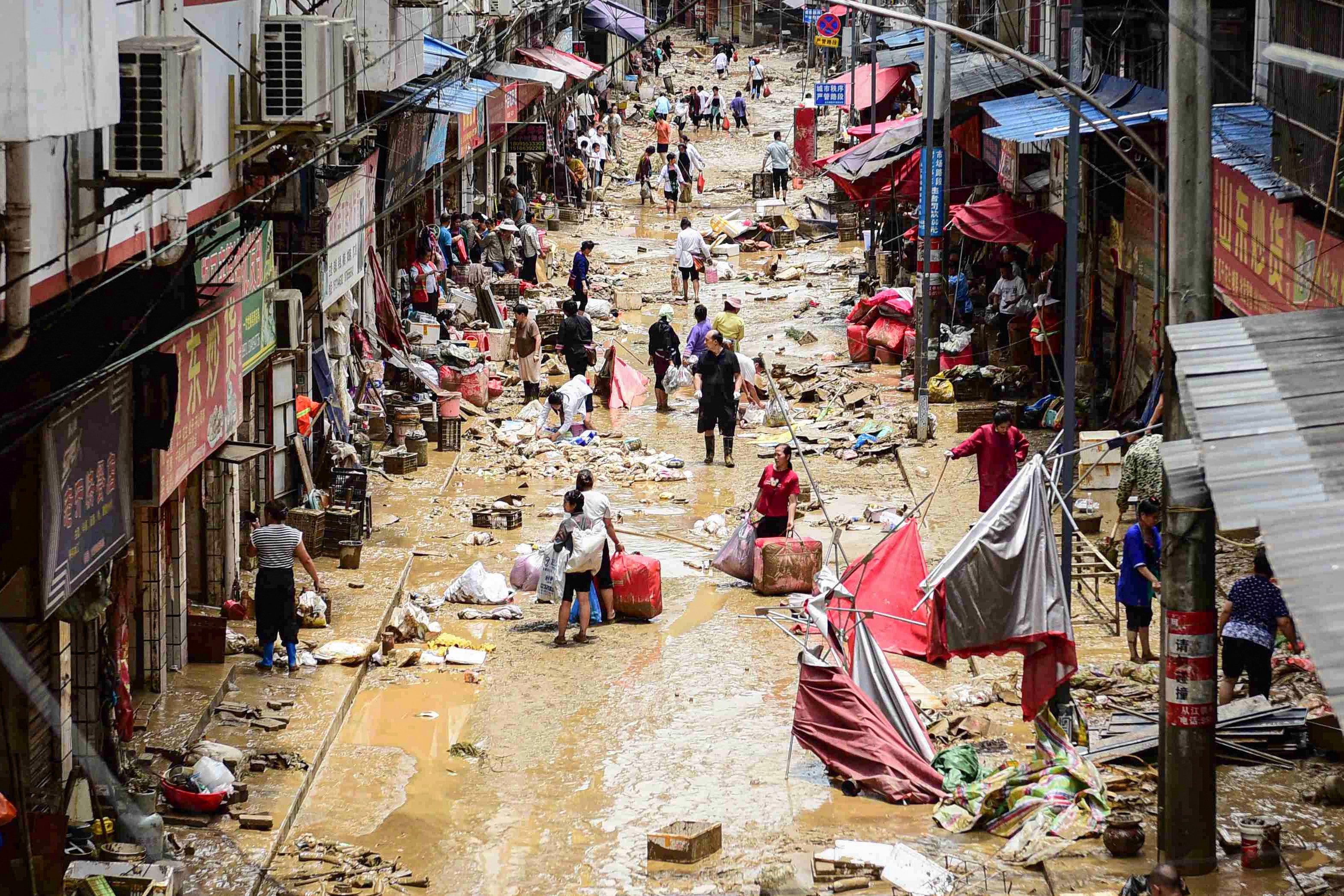 China expands payouts for flood victims