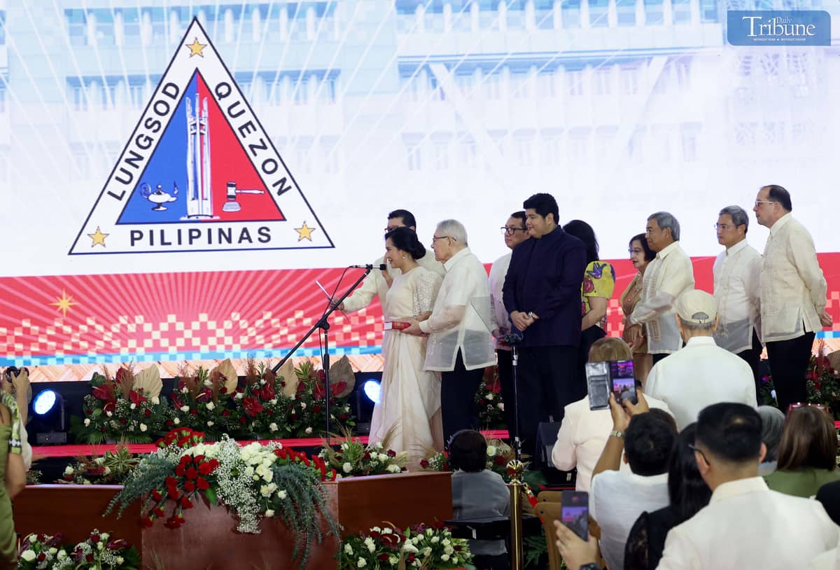 QUEZON City Mayor Joy Belmonte, along with her family takes her oath of office for her last term before Supreme Court Chief Justice Alexander Gesmundo during the inaugural ceremony of newly elected officials at the Meeting, Incentives, Conferences, and Exhibitions (M.I.C.E.) Center inside the Quezon City Hall compound on Monday. Photo/Analy Labor